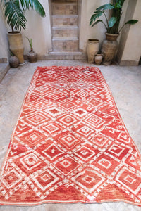 Authentic vintage Moroccan rug low pile cherry red with white colored tribal motifs