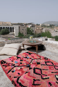 Small pink Boujad Moroccan rug with abstract patterns