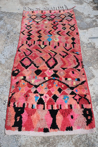 Small pink Boujad Moroccan rug with abstract patterns